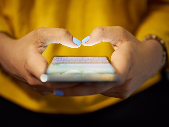 woman typing on a mobile phone